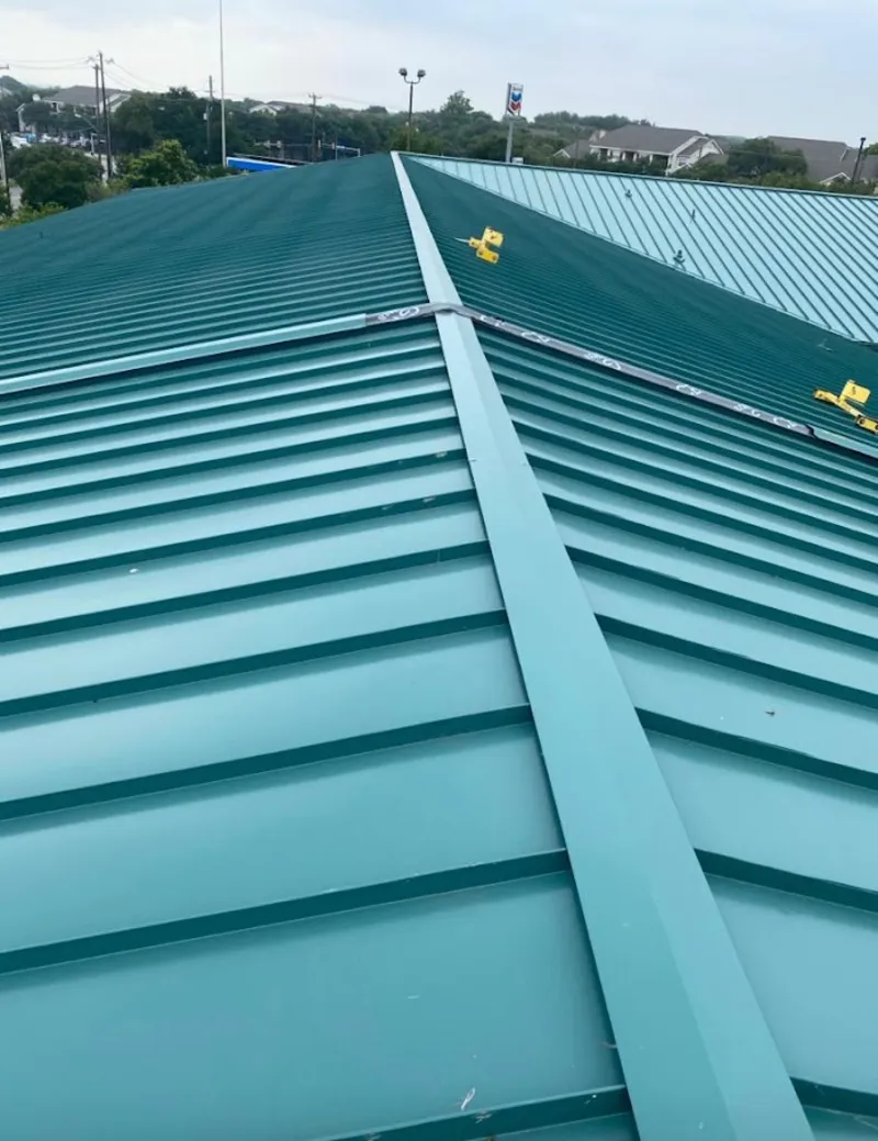 Green commercial metal roof ridge and valley for Metal Roof Repair in Haverhill